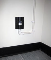 AT-G-DETECT sensor fitted at low level within an electrical room.